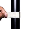 IMG_0064 - Speedtech International A hand secures a SPEEDWRAP® High Temp Cinch Strap around a black cylindrical pole against a white background.